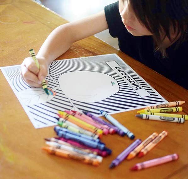 Kid with green crayon