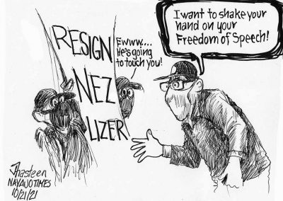 President Jonathan Nez, with mask, attempts to shake hands of protesters shocked, masked and holding sign saying Resign Nez Lizer. One protester says errrr, he is going to touch you.