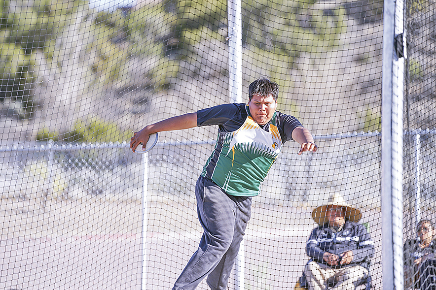 Thoreau discus thrower meets 3A state mark