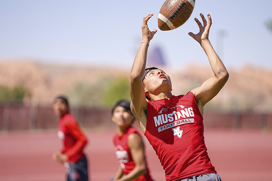 MV football working with young group